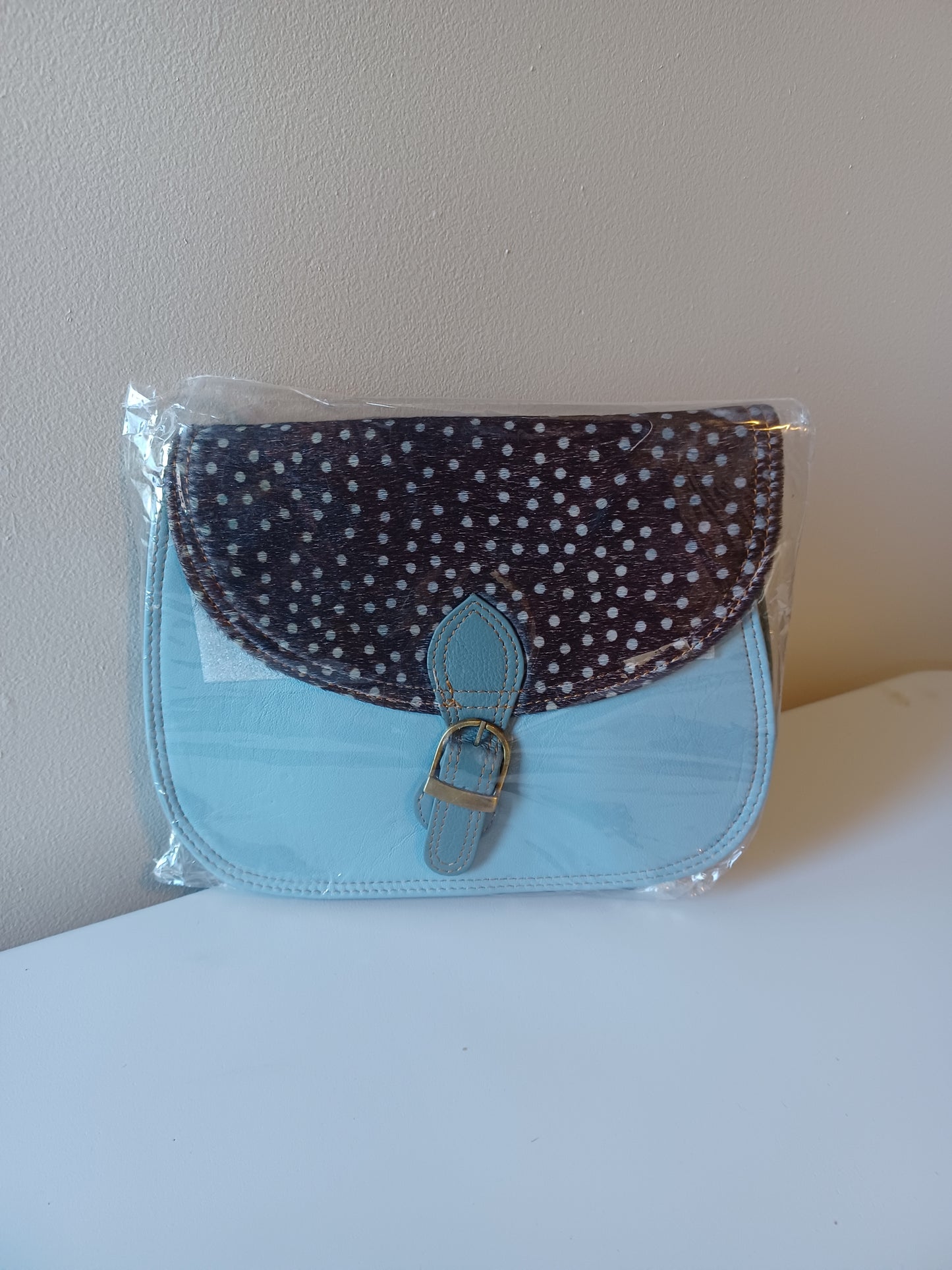 Leather sling bag.